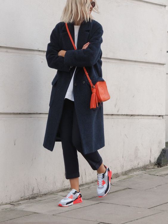 woman wearing a casual outfit with trainers