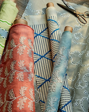 Rolls of embroidered and patterned fabrics
