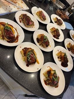 Multiple small plates of gourmet appetizers