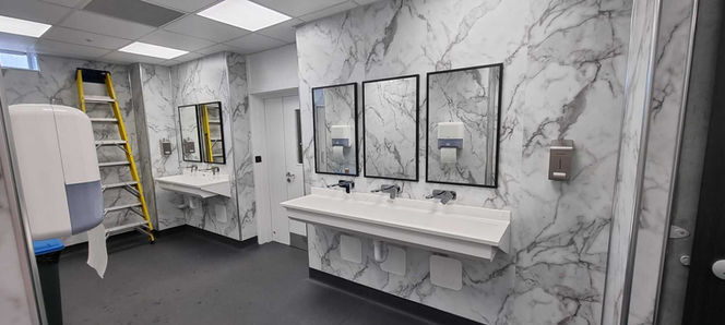 suspended ceiling installation process in public bathroom