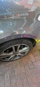 dent on silver car