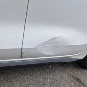 dent on car door