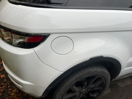 rear side of white SUV