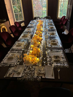 Elegant dining table with yellow floral centerpieces
