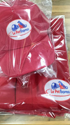 Red shirts with white staff badges for event

