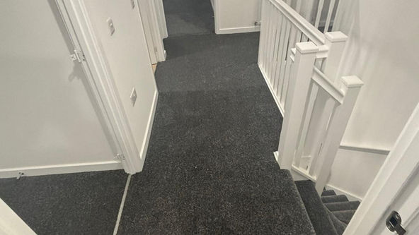 grey carpet in hallway and bedroom