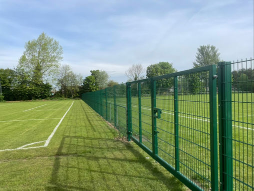 Green fencing in field