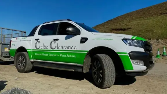 Branded waste clearance pickup truck