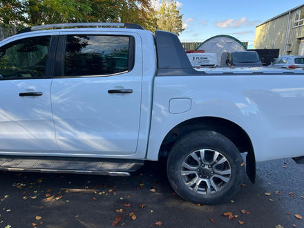 side view of white car double door