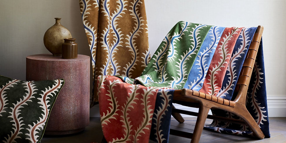 Patterned fabrics in various colors displayed on a chair