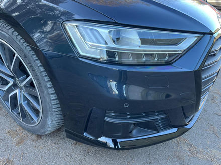 scratch on front side of black car