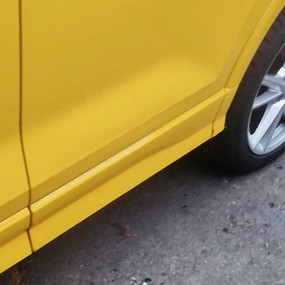 side view of yellow car