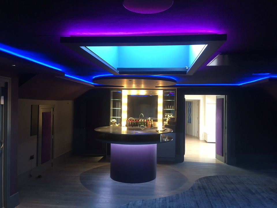 futuristic bar area with blue and pink mood lighting