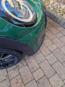 view of front side of small green car