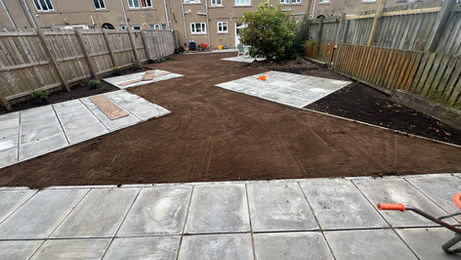large concrete slabs being installed in a garden