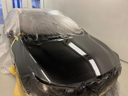 black car paint spray on sedan car