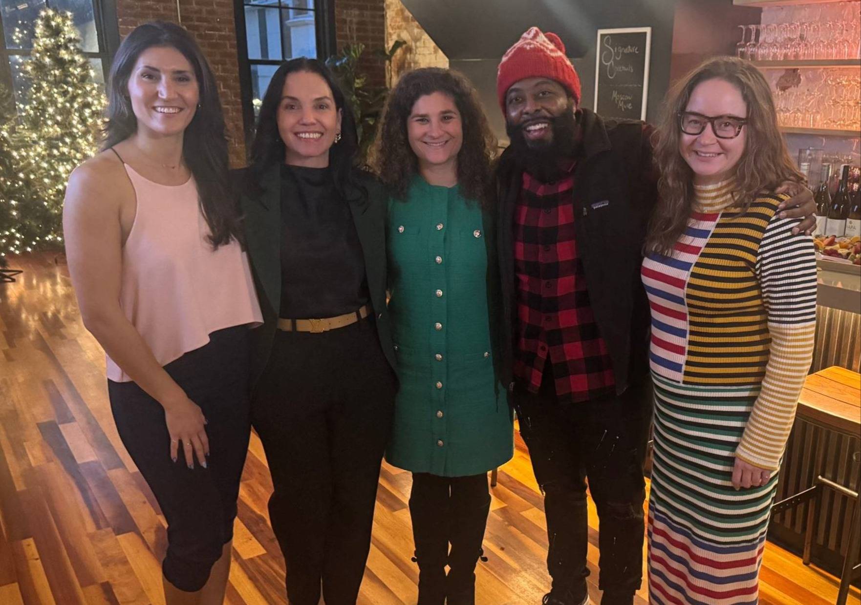 A group of professionals posing while at a networking event