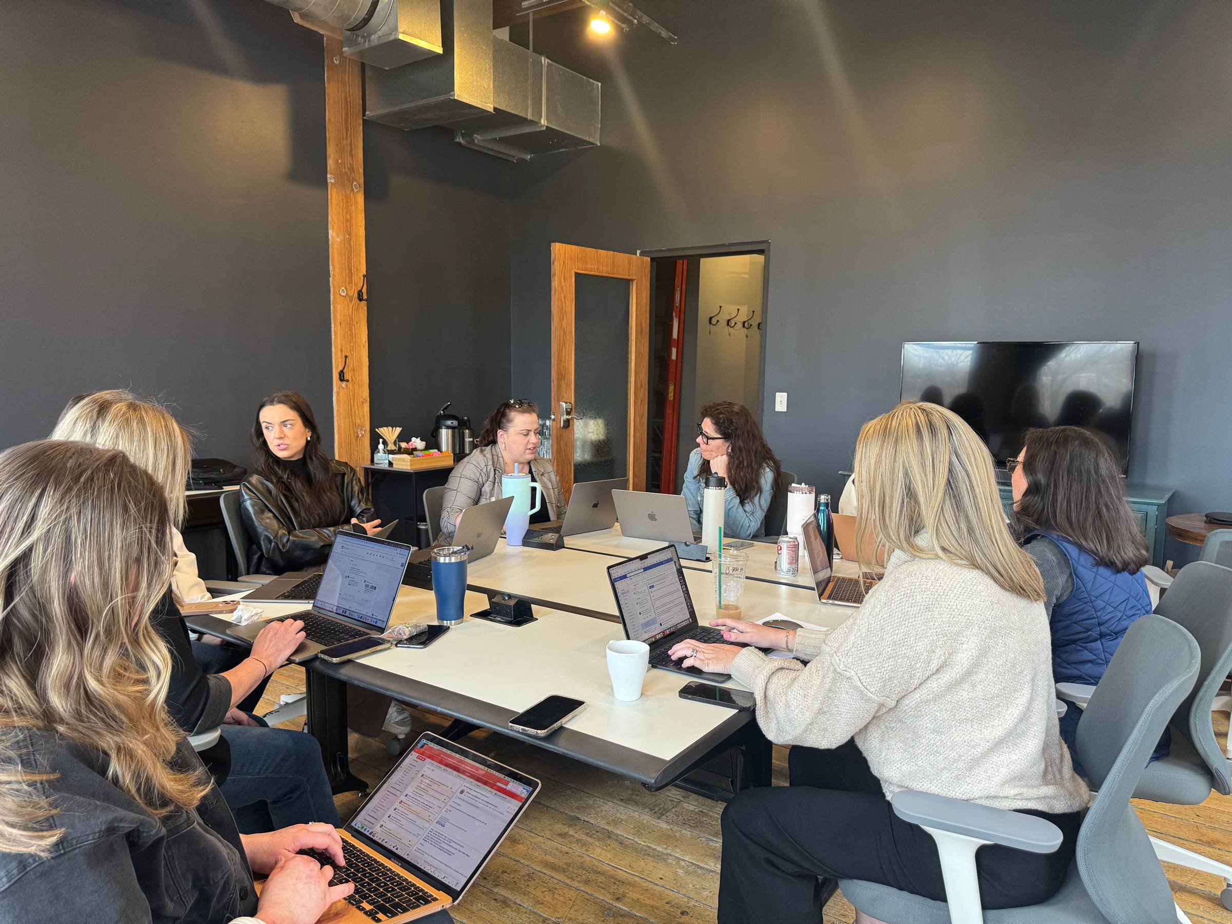 A group of professionals sitting around a table