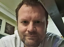 In the kitchen smiling at you