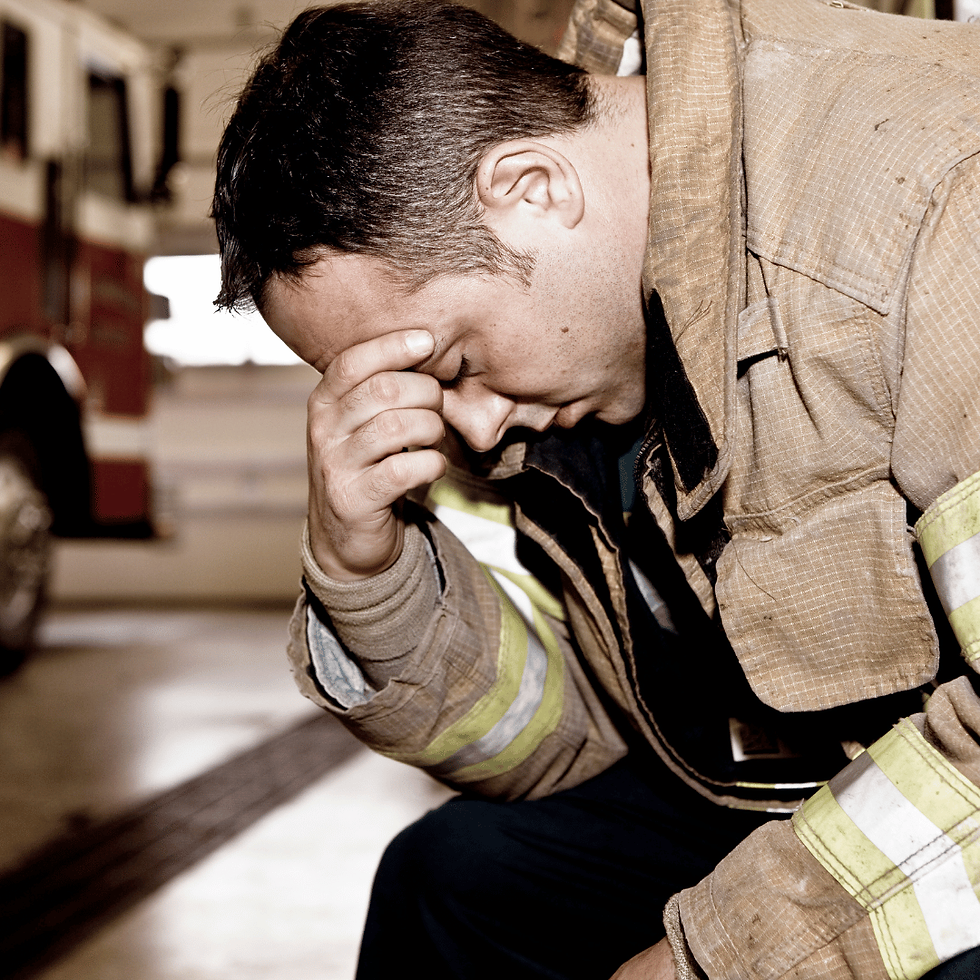 Firefighter with head in hand