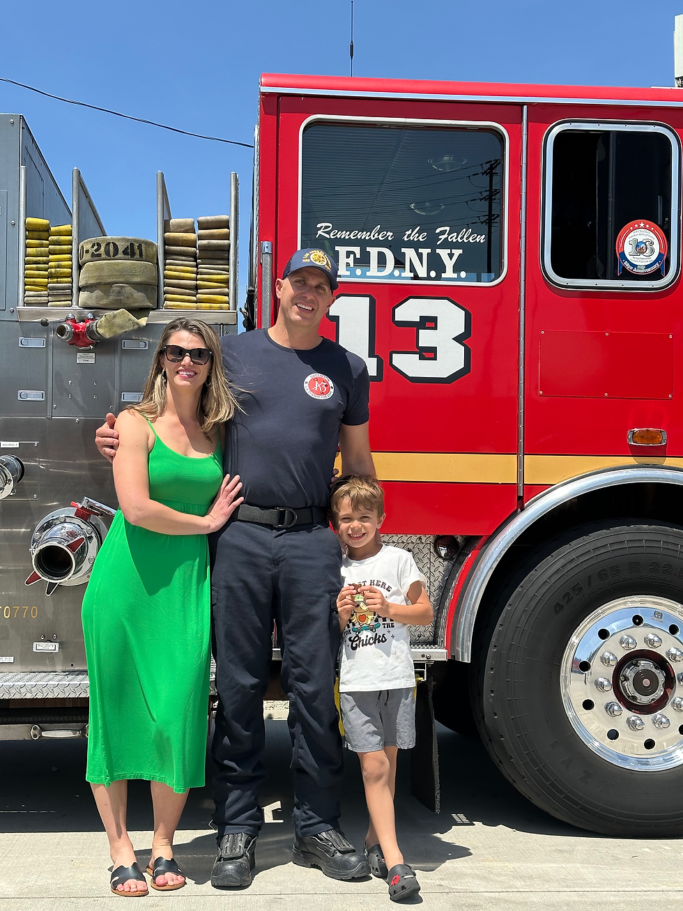 Los Angeles County Fire Family standing next to a fire truck