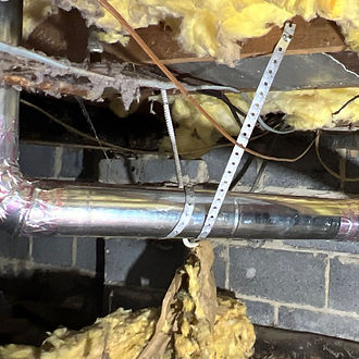 Old foil dryer duct running through insulation in a Fairfax, VA home