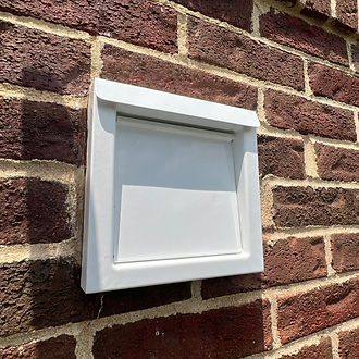 New exterior dryer vent hood on a brick home in Falls Church, VA