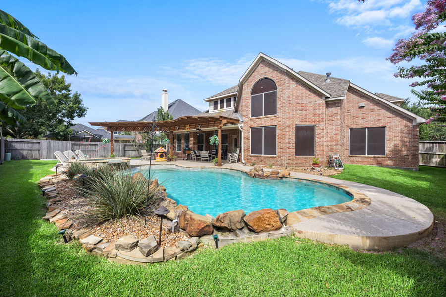 Luxury home exterior with landscaping: architectural and real estate photography, Greater Houston by Marz Media Photography
