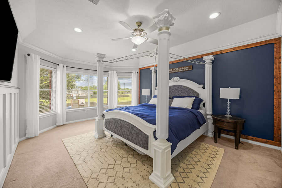 Guest bedroom with French doors: luxury real estate photography in Houston, TX by Marz Media Photography