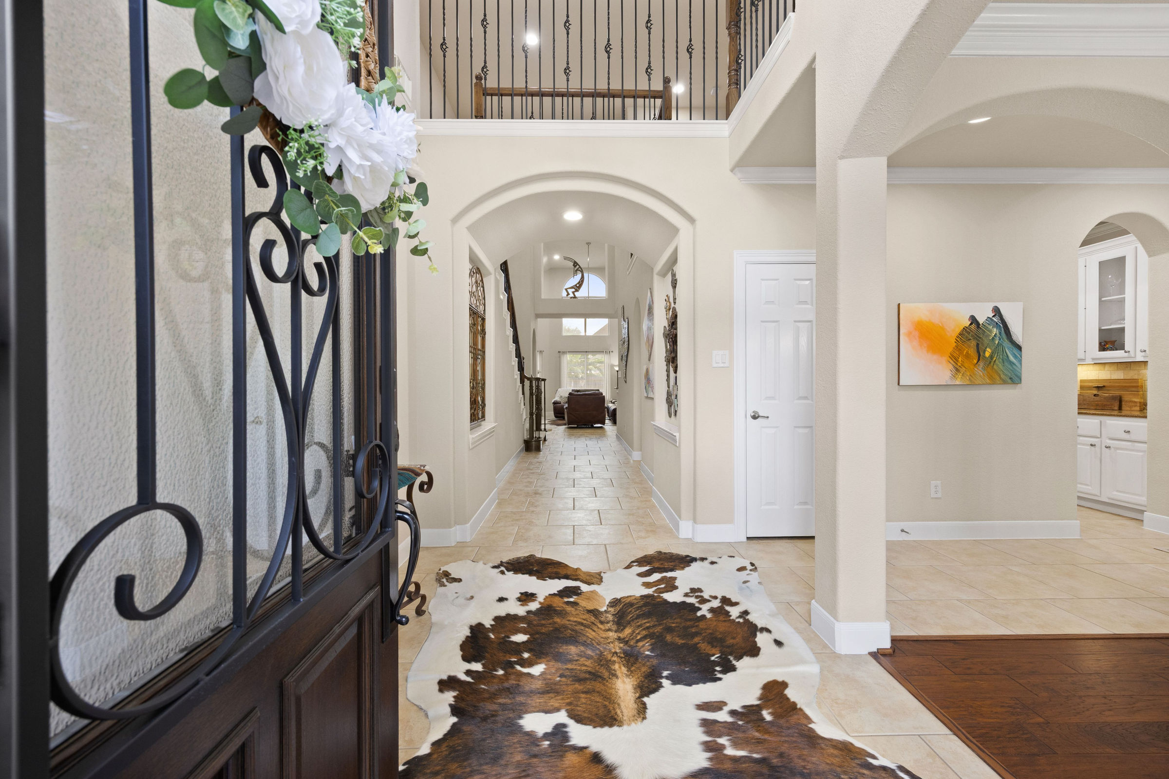 Entry hall with wainscoting and hardwood floors: luxury real estate photography in Houston, TX by Marz Media Photography