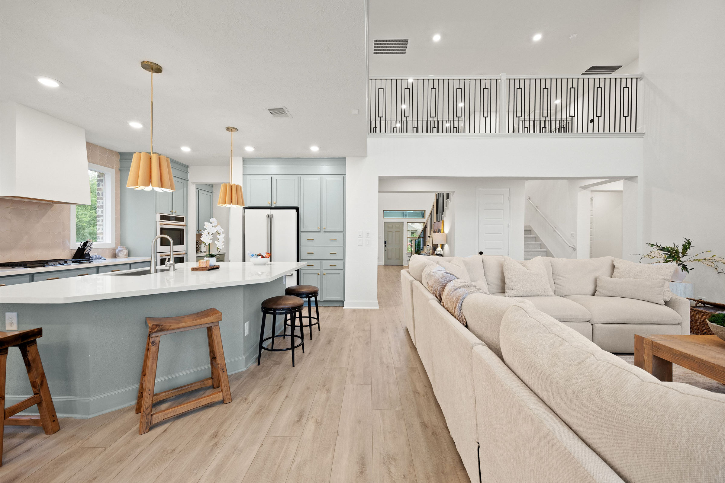 Open-plan kitchen and living area: luxury real estate photography in Houston, TX by Marz Media Photography