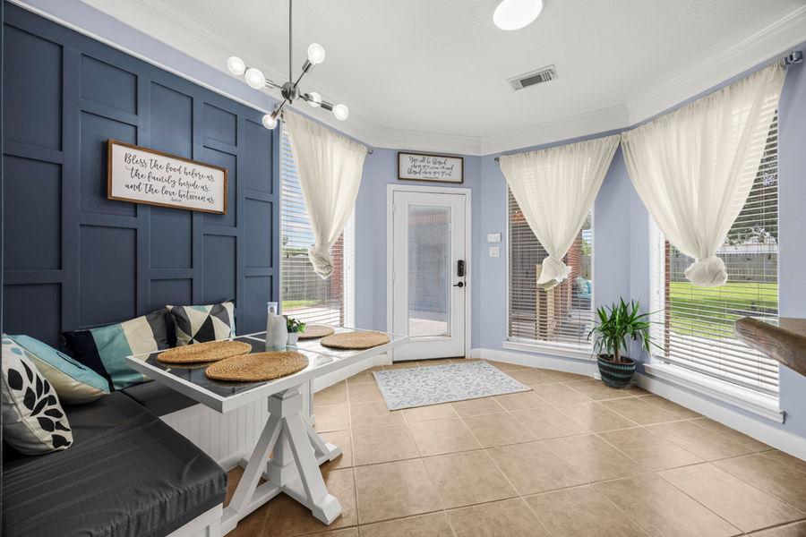 Primary bedroom with French doors: Houston real estate photography by Marz Media Photography