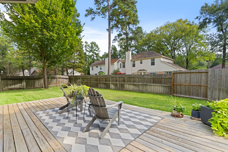 Landscaped backyard with wood deck: architectural and real estate photography, Greater Houston by Marz Media Photography