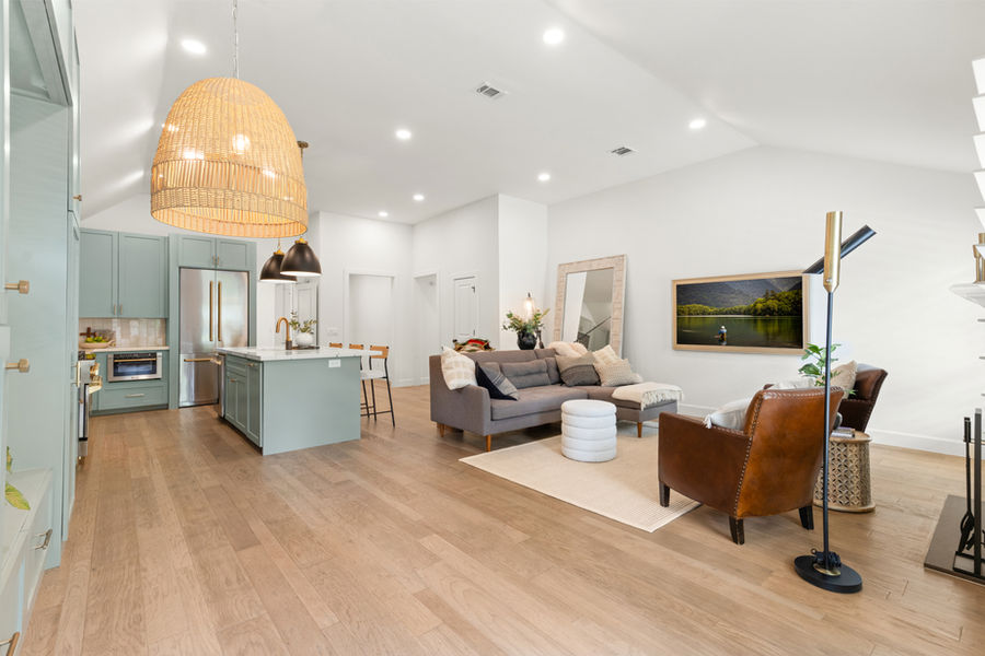 Open-concept living with hardwood floors: luxury real estate photography in Houston, TX by Marz Media Photography
