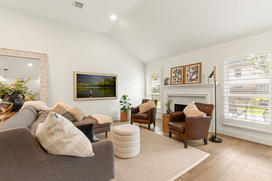 Styled living room with recessed lighting: Houston real estate photography by Marz Media Photography