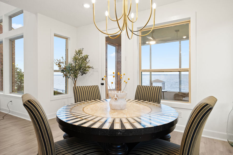 Dining room with sliding glass doors: Houston real estate photography by Marz Media Photography