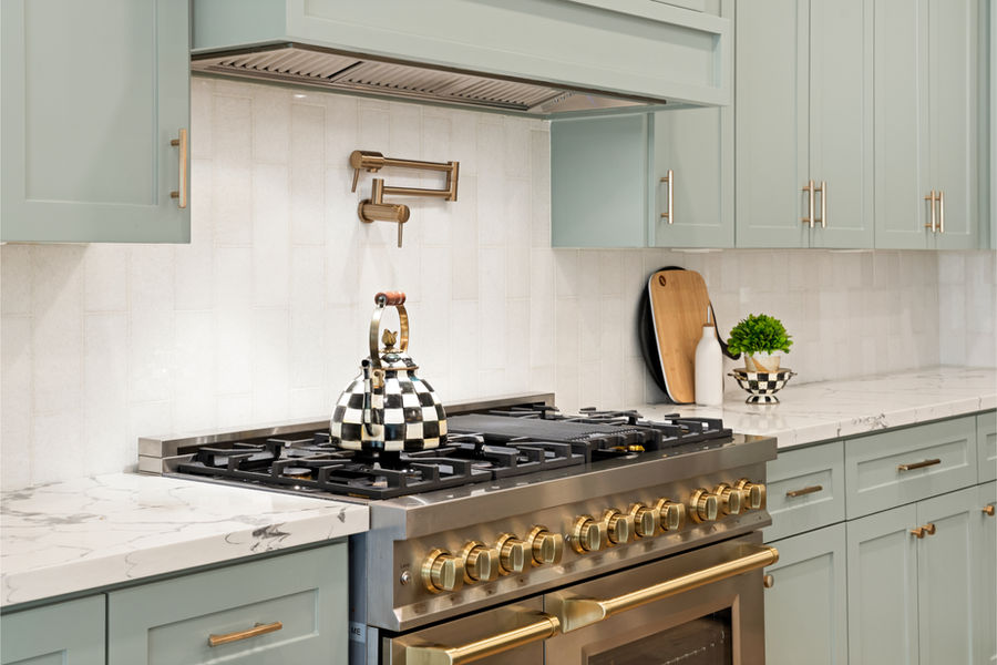 Gas cooktop with tile backsplash: luxury home photography, Houston by Marz Media Photography