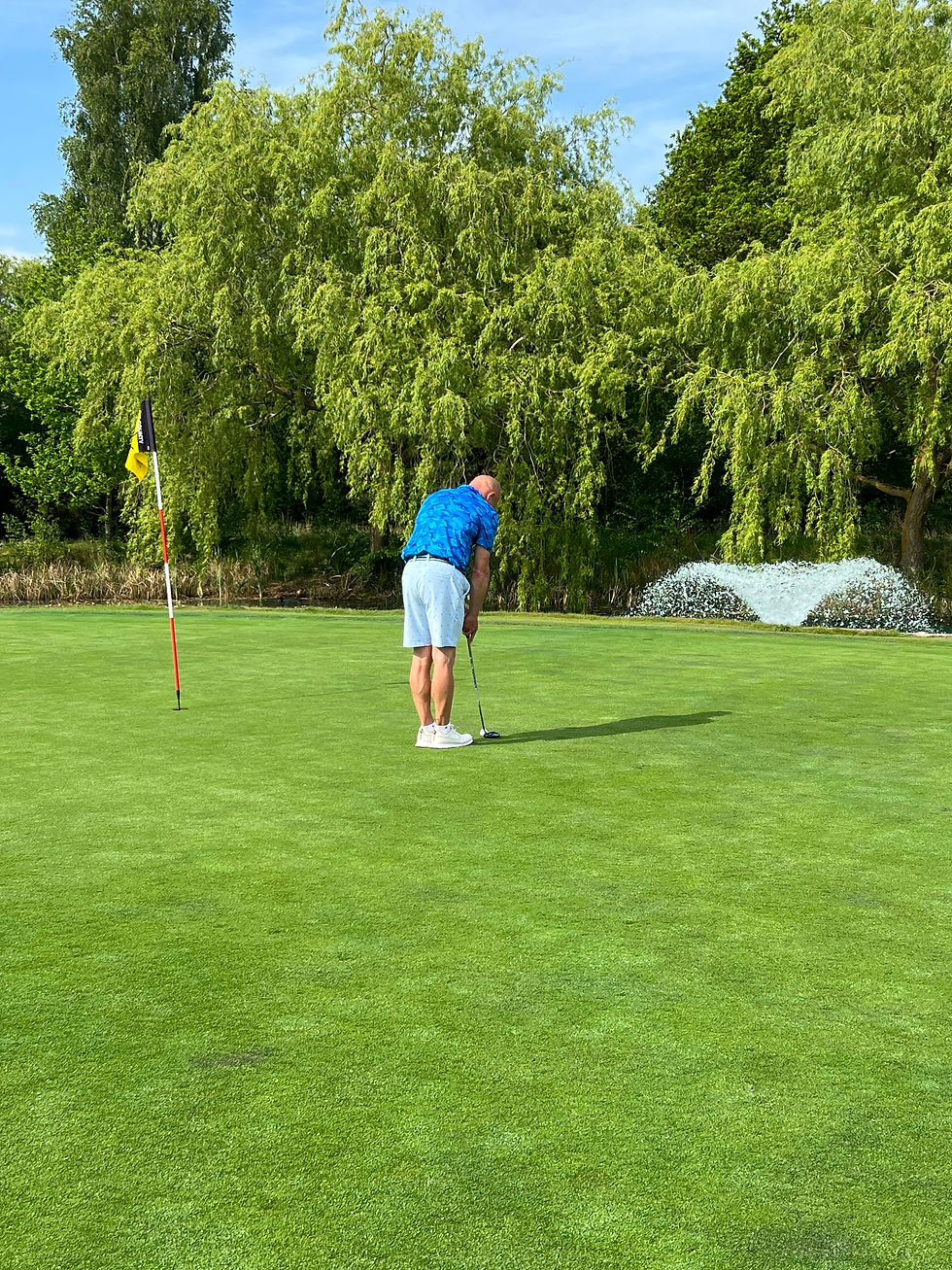 Putting on the 18th green at The Essex Golf Club during a round in 2025