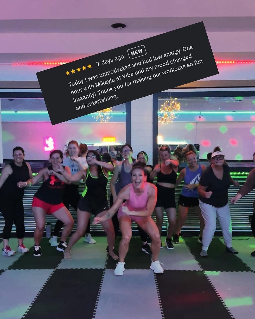 Eye-level view of a fitness class in session with instructors directing participants