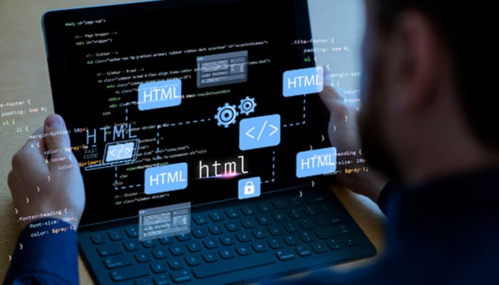 Developer coding HTML on a tablet with graphical representations of HTML code, web development tools, and cloud computing icons. Focused on building responsive web pages.