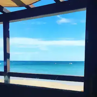 view from beach bar burgau.webp