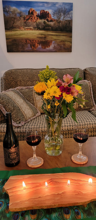 Rock Candle on coffee table with flowers and wine