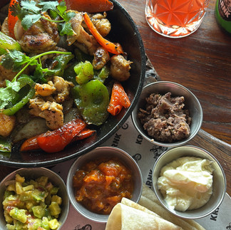 Chicken fajitas with grilled peppers and salsa at KRNK restaurant in Kuta Lombok.
