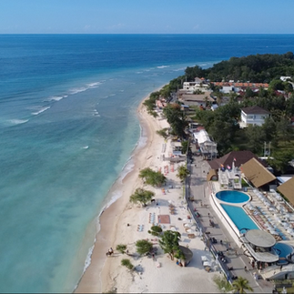 Aerial view of Gili Trawangan with beachfront accommodation and turquoise water