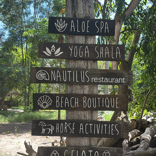 Gili Asahan resort sign showing spa, yoga, and restaurant facilities - eco retreat on southwest Lombok