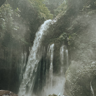 Tiu Kelep waterfall cascading through dense jungle in North Lombok