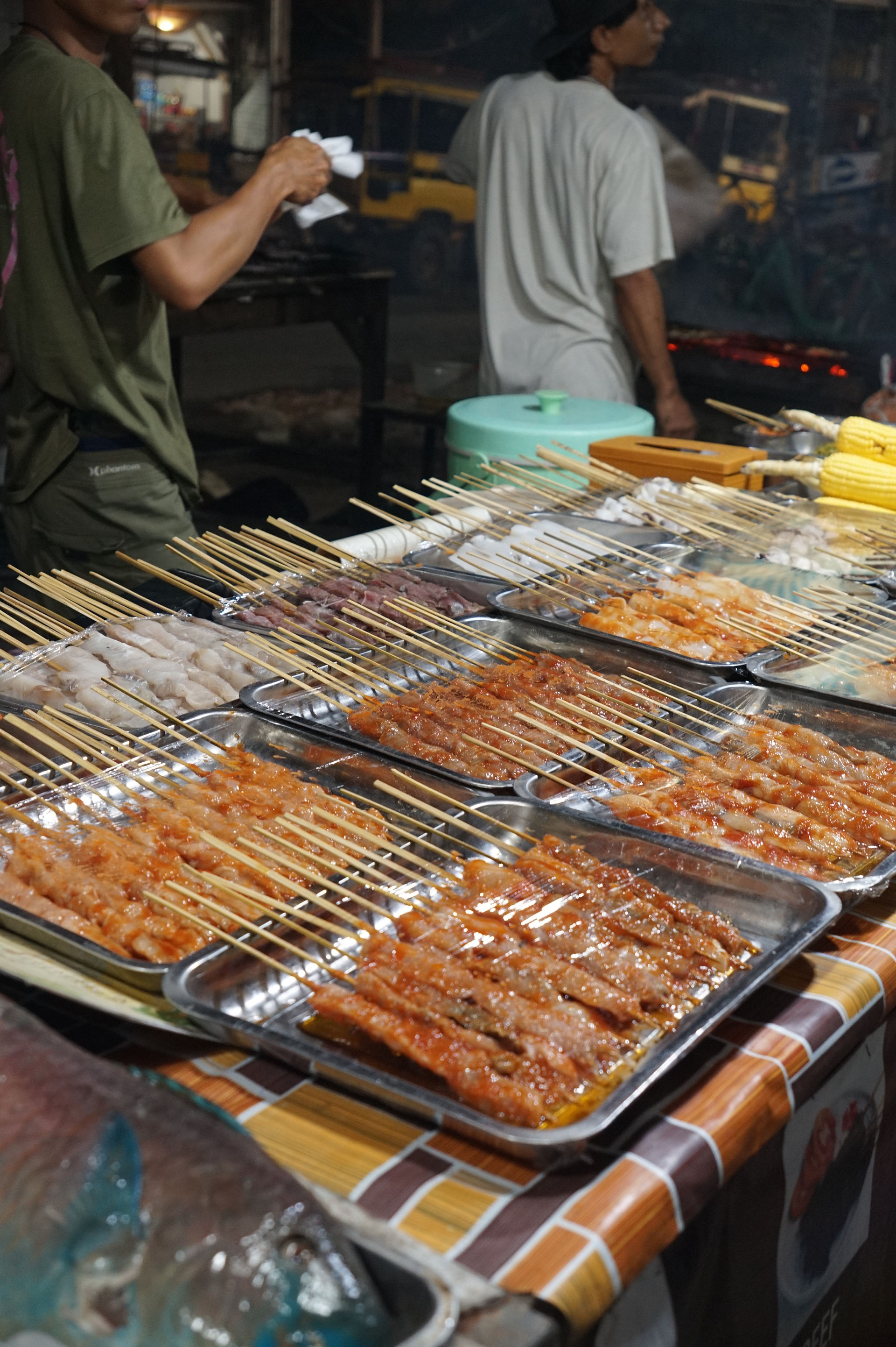 Grilled satay skewers and local street food being prepared at the Gili Trawangan Night Market.