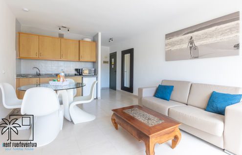 Living room with sofa, table, and chairs, Palmira