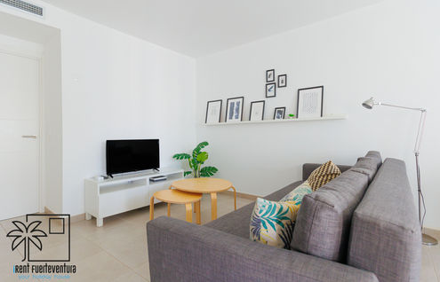 Living room with Smart TV and fast internet connection, Coral Sun