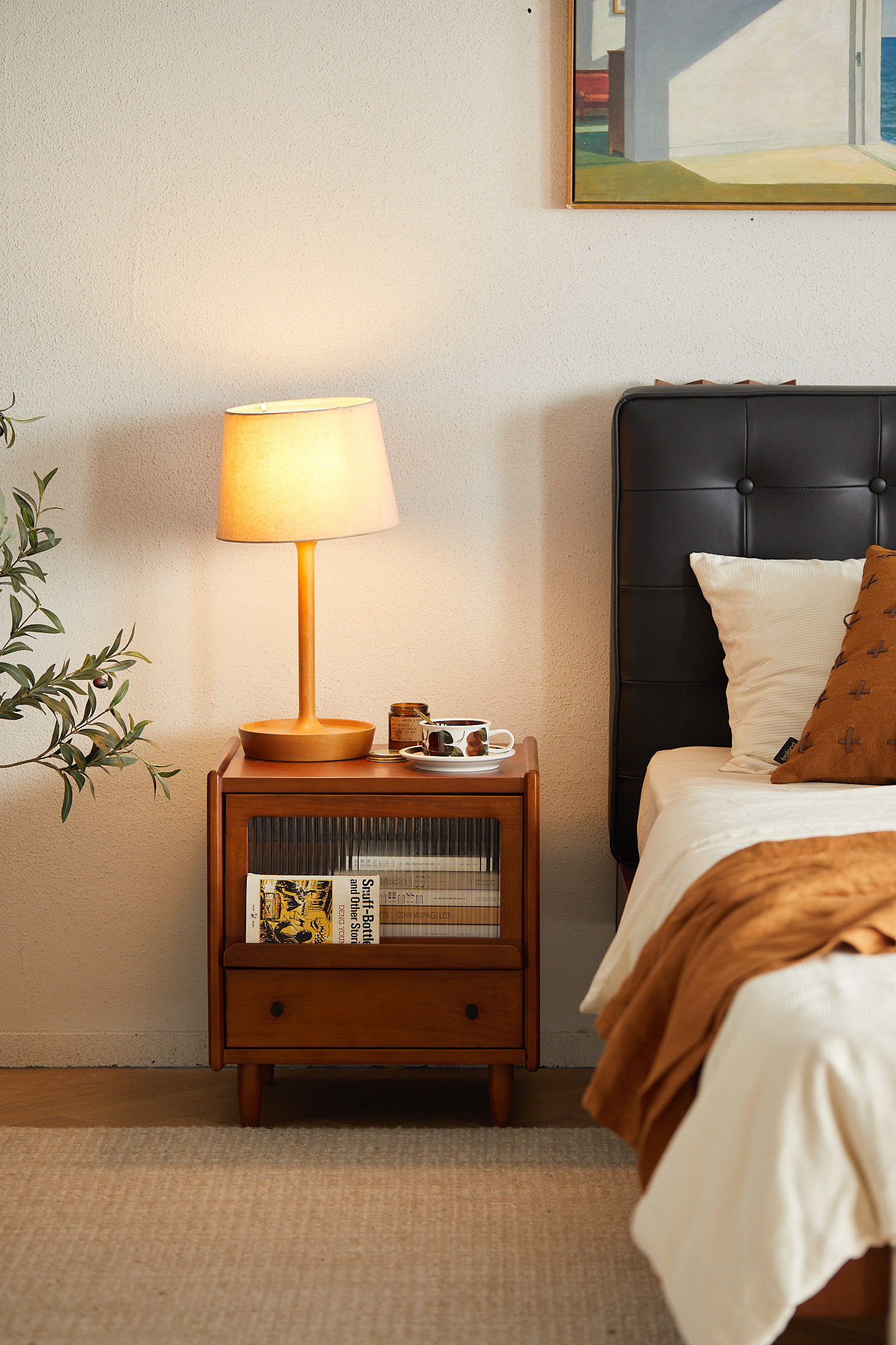Cozy bedroom setup featuring Kyoto-45 fluted glass bedside table with warm lamp lighting